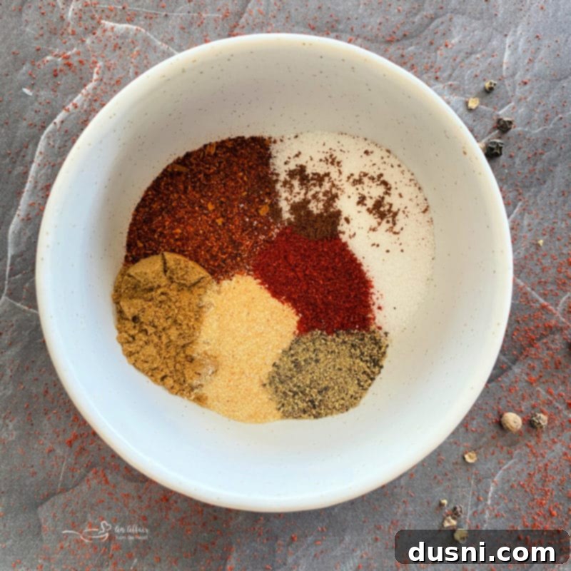 Individual spices and ingredients laid out for the fajita seasoning blend.