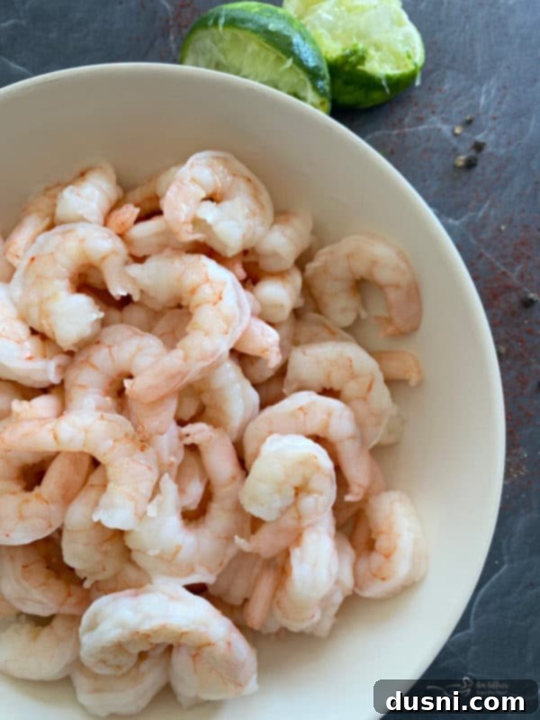 Raw shrimp, peeled and deveined, with tails removed, ready for marinade.
