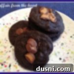 several Double chocolate peanut butter cookies on a funfetti plate