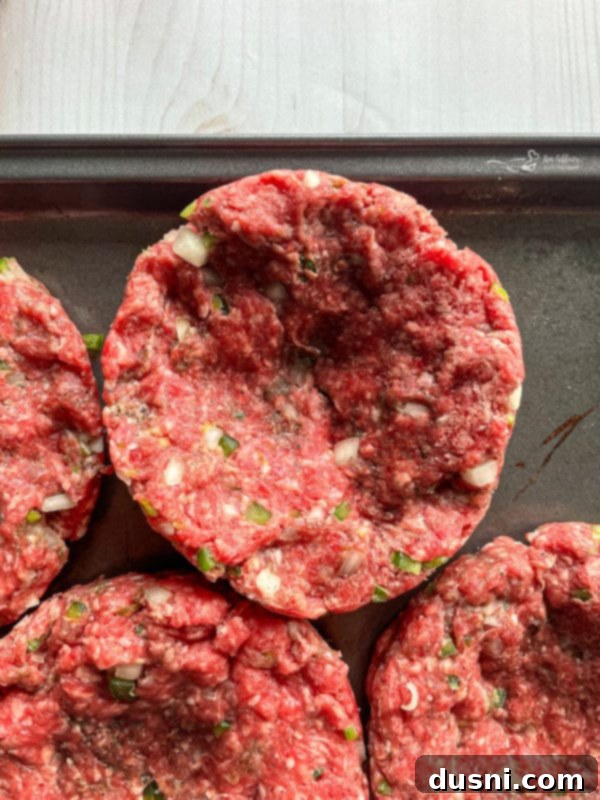 Image showing how to form large, dimpled burger patties from the meat mixture.