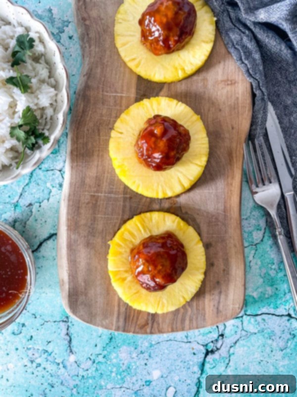 Pineapple Glazed Hawaiian Ham Bites 11 Ham balls on pineapple wheels