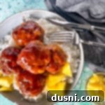 Pineapple Glazed Hawaiian Ham Bites 14 Top view of Hawaiian ham balls in bowl with rice