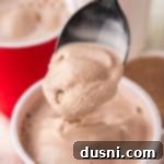 Whip Up a Homemade Frosty 14 A spoon digging into a Copycat Wendy's Frosty.