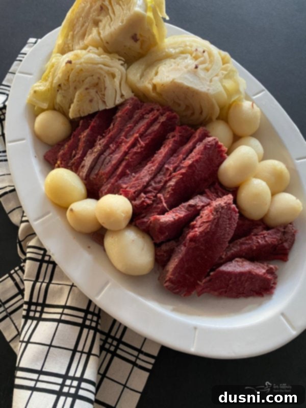 Easy Crock Pot Corned Beef and Cabbage 2 Tender Slow Cooker Corned Beef and Cabbage Dinner served with potatoes
