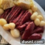 Easy Crock Pot Corned Beef and Cabbage 9 Corned Beef & Cabbage Dinner in a white serving dish