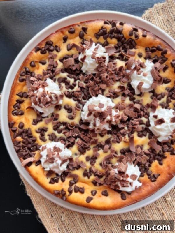 Creamy Irish Dream Cheesecake 11 A slice of Irish Cream Cheesecake being lifted from a serving dish.