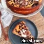 Creamy Irish Dream Cheesecake 15 Irish Cream Cheesecake whole and sliced piece on plate