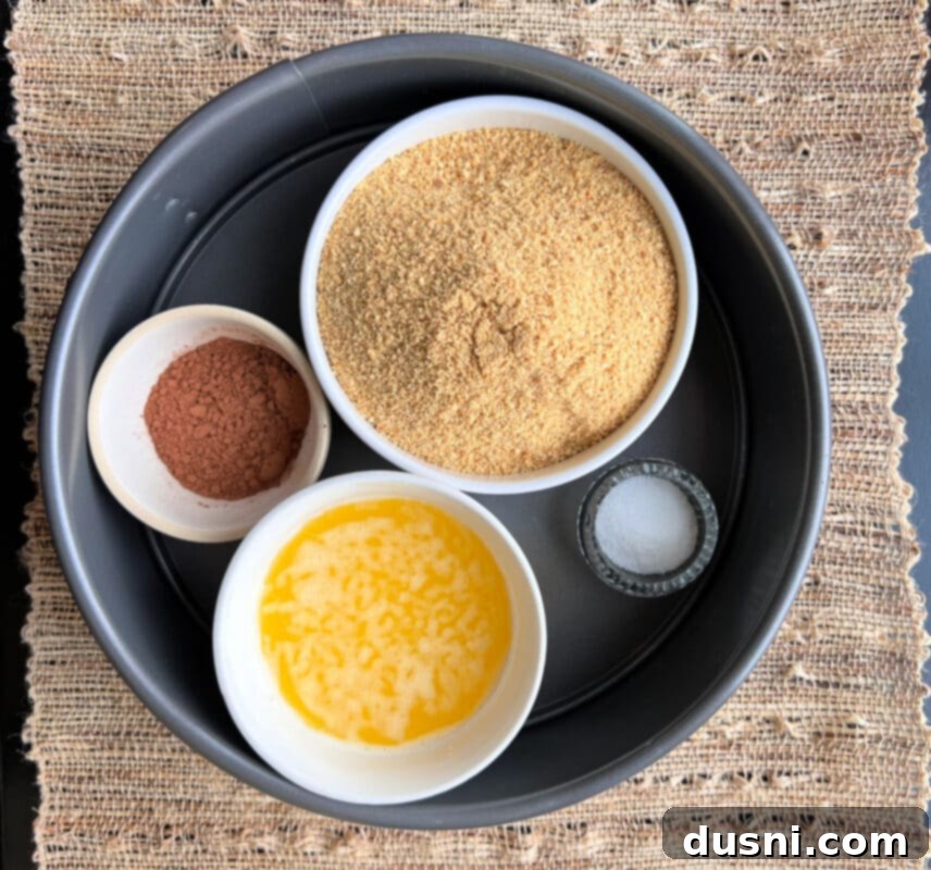 Creamy Irish Dream Cheesecake 4 Ingredients for Irish Cream Cheesecake, including cream cheese, eggs, Irish cream, and chocolate chips.