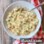 KFC Cole Slaw Copy Cat with a serving spoon in a bowl