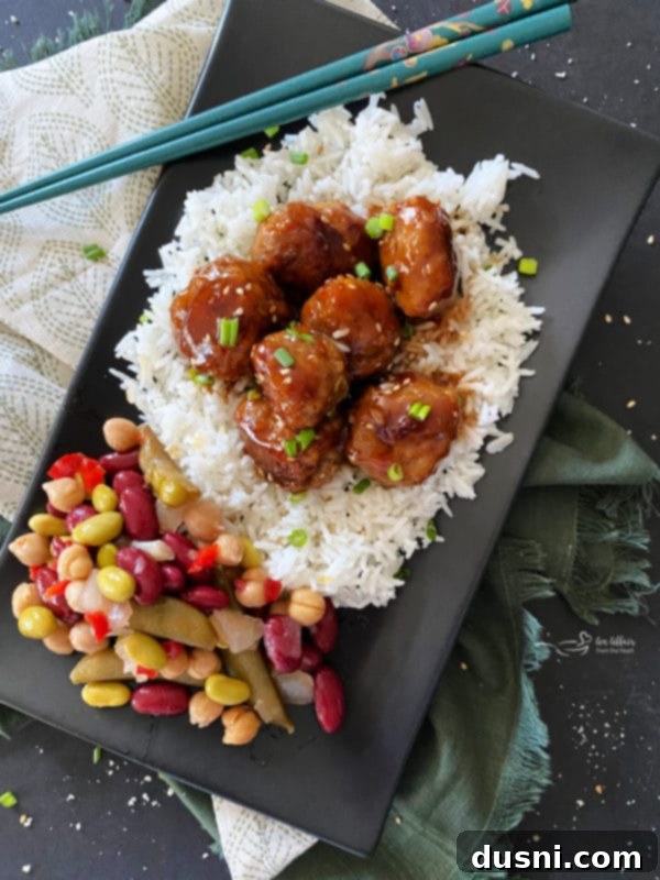 Complete meal with Sticky Asian Meatballs, rice, and Paisley Farm Asian Bean Salad