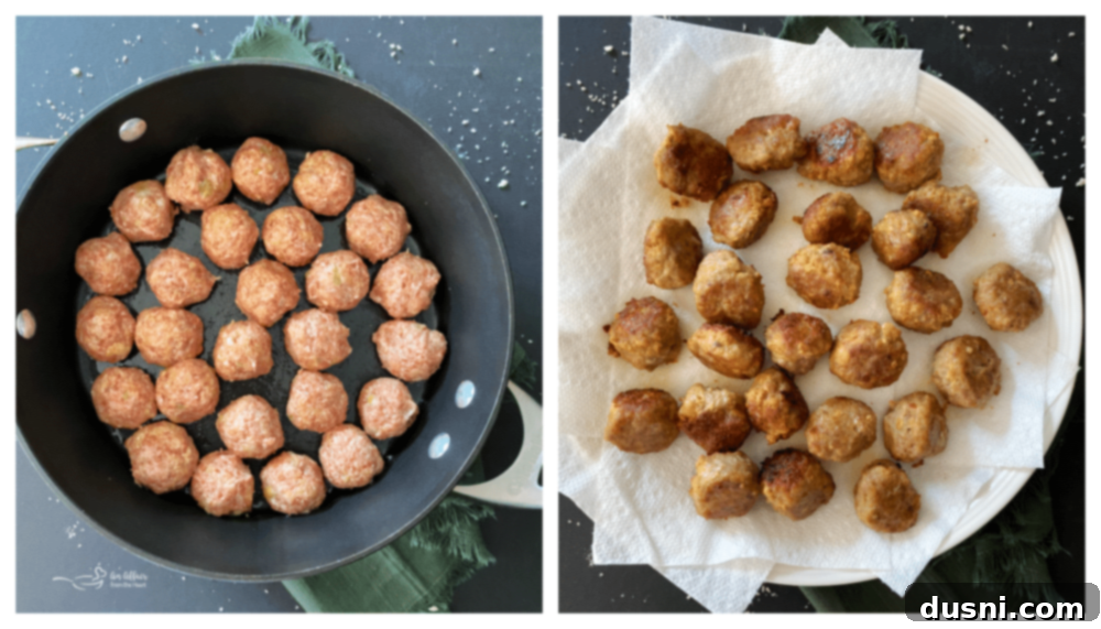 Meatballs browning in a skillet on the stovetop