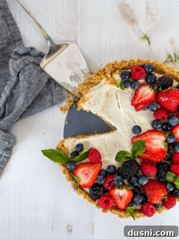 Effortless Fruit Delight 2 top view of one no bake fruit tart with fresh berries and mint