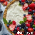 Effortless Fruit Delight 15 Top view of no bake fruit tart with fresh blueberries, strawberries, blackberries, and raspberries