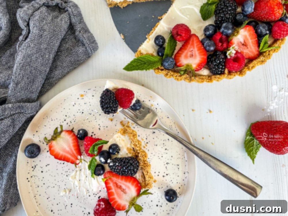 Effortless Fruit Delight 10 one plate with a slice of no bake fruit tart with fresh berries