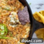 chip being dipped in jalapeño popper dip