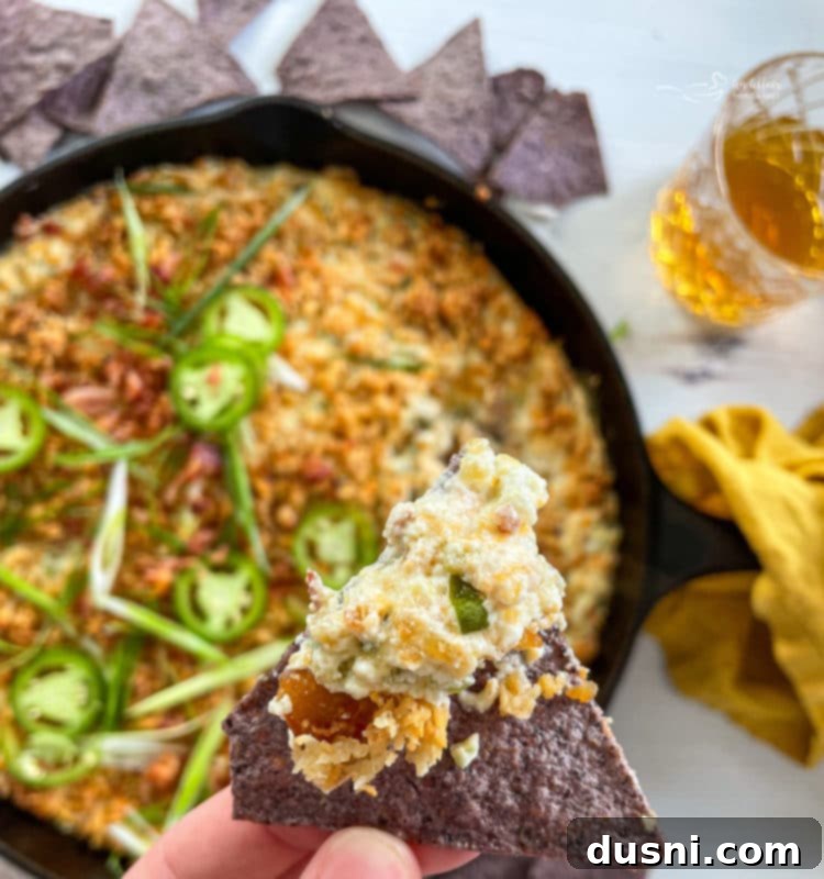 top view of jalapeño popper dip with spoon