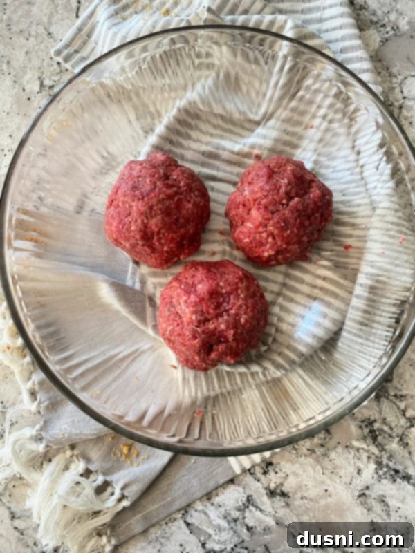 Dividing ground beef mixture for krautburgers