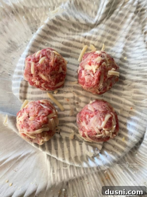 Forming meatballs with kraut and cheese mixture