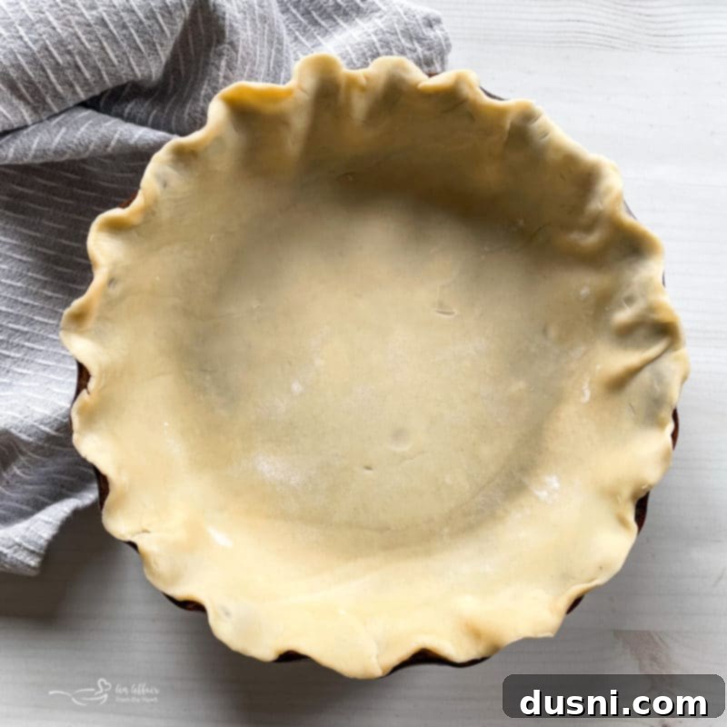 Forming pie dough into a firm ball by hand