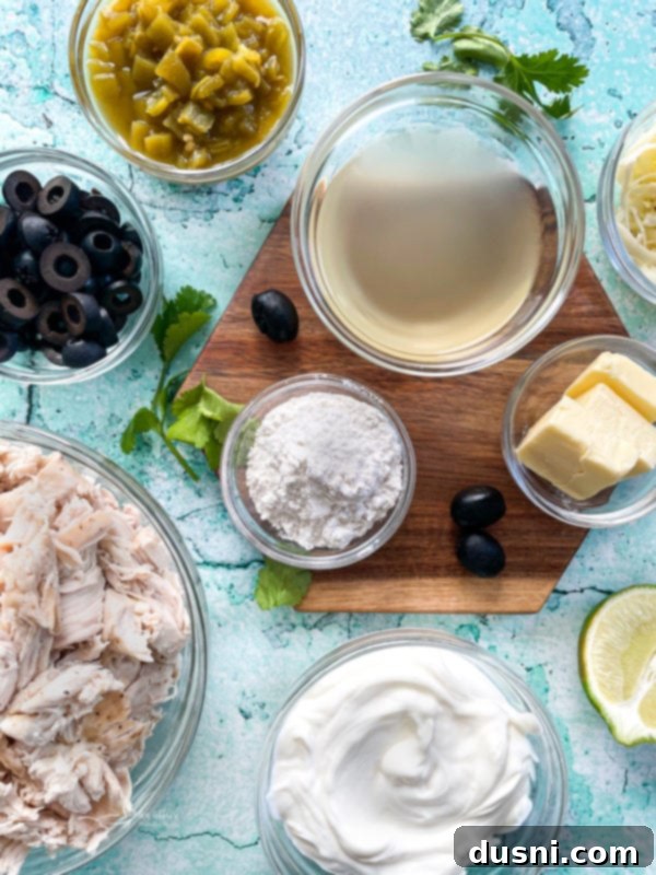 Creamy White Chicken Enchiladas 4 Close up of white chicken enchiladas in dish