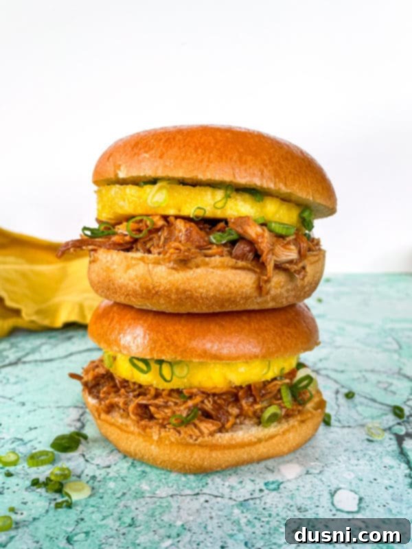 Crockpot Luau Chicken Sandwiches 2 Juicy Slow Cooker Hawaiian BBQ Chicken Sandwiches on Hawaiian buns with pineapple and green onion