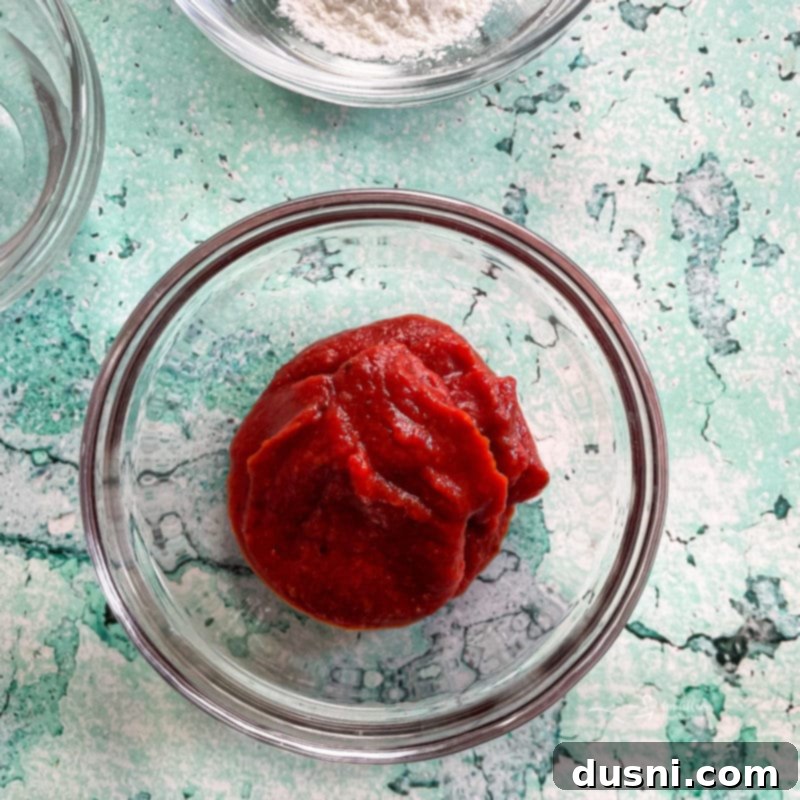 Crockpot Luau Chicken Sandwiches 6 Whisking the homemade Hawaiian BBQ sauce ingredients in a bowl