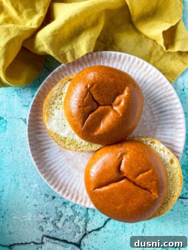 Crockpot Luau Chicken Sandwiches 7 Cooked chicken breasts covered in Hawaiian BBQ sauce in the slow cooker