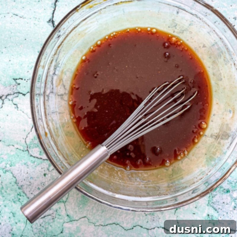 Crockpot Luau Chicken Sandwiches 8 Raw chicken breasts at the bottom of a slow cooker