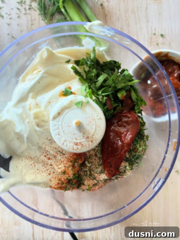 top view of food processor with sour cream and mayonnaise 