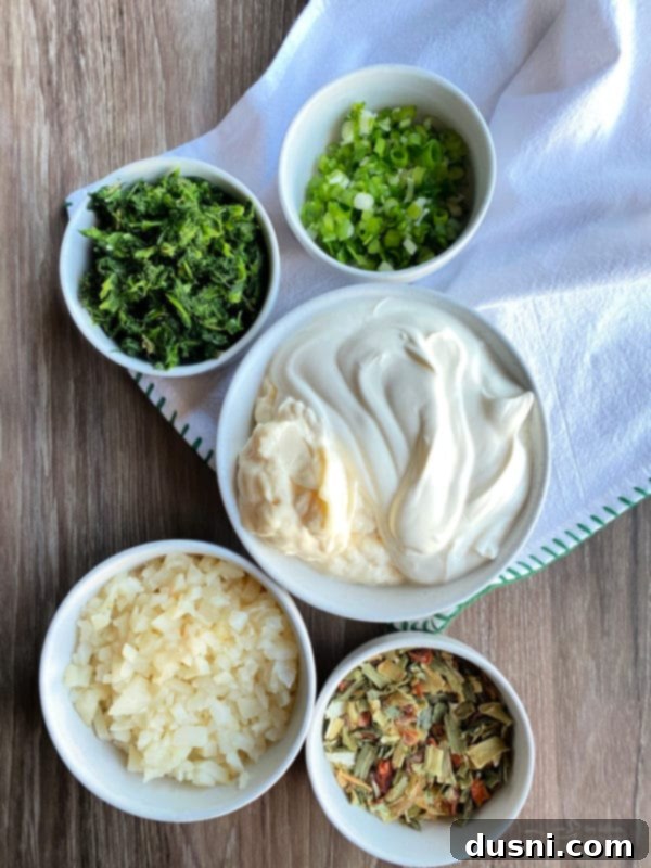 Ingredients for Cool Spinach Dip arranged on a cutting board