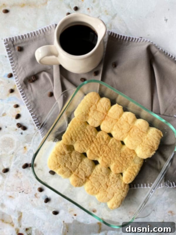 Ladyfingers arranged in a baking dish.