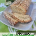 Delicious lime coconut bread on a white platter with the text "Put the Lime in the Coconut Bread"