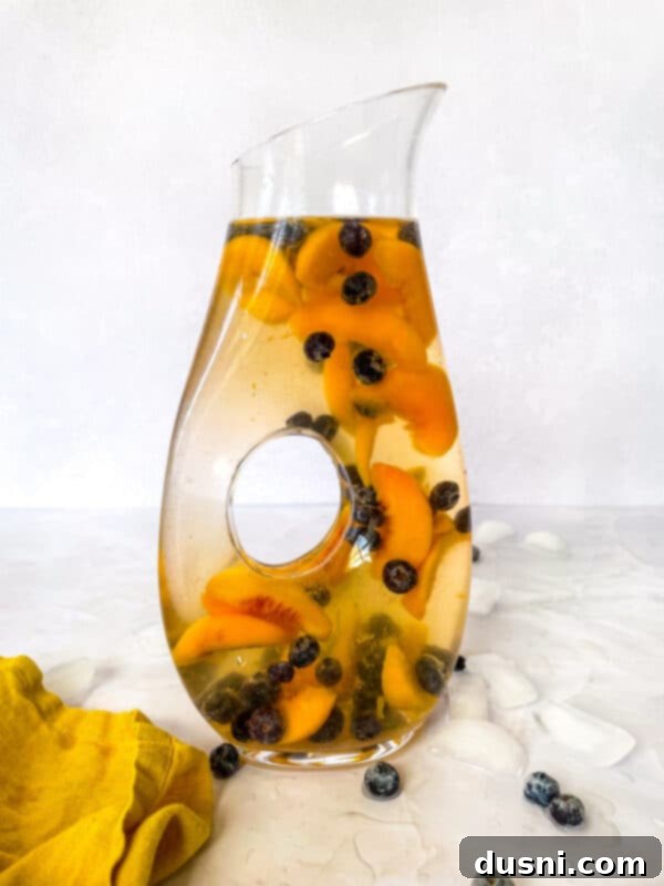 Rose Sangria in a clear glass with fruit