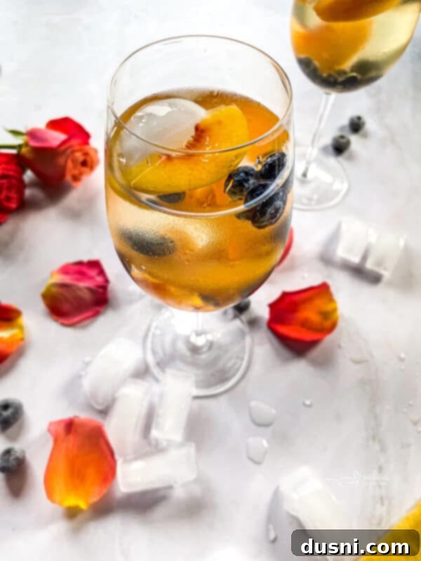 Two glasses of Rose Sangria with a pink background