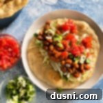 Native Fry Bread Tacos 16 Indian Tacos in fry bread, white plate, blue background