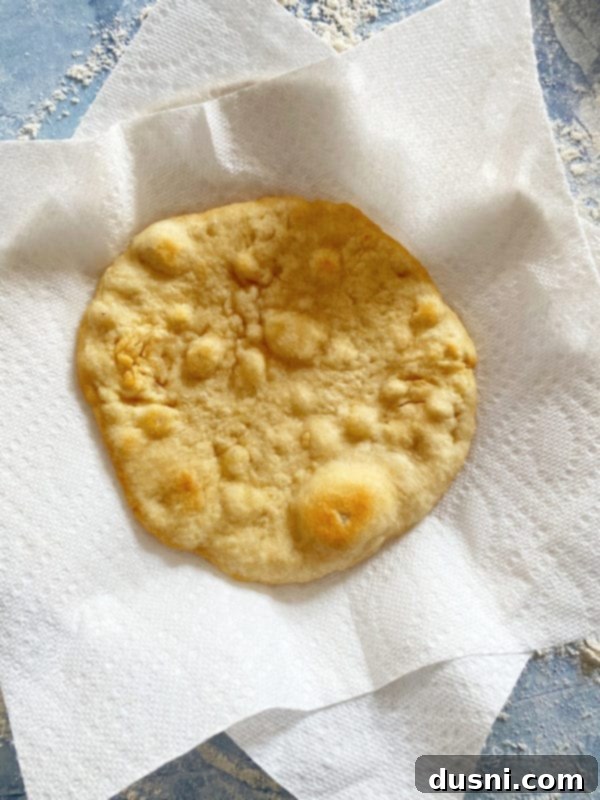 Native Fry Bread Tacos 7 Freshly fried golden Indian Fry Bread in a skillet.