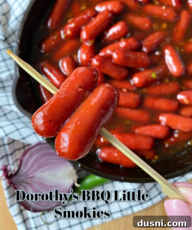 Dorothy's BBQ Little Smokies in a bowl with a serving spoon.