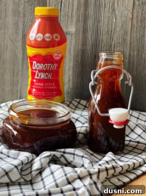 Homemade Dorothy Lynch BBQ Sauce being stirred in a saucepan.