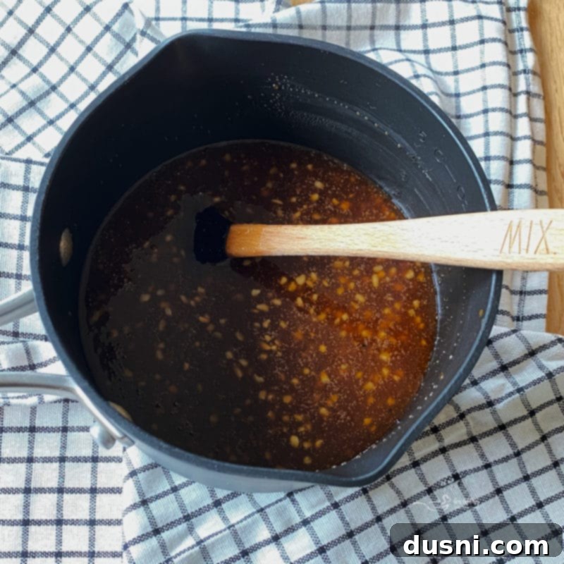 Dorothy Lynch BBQ Sauce simmering in a saucepan.