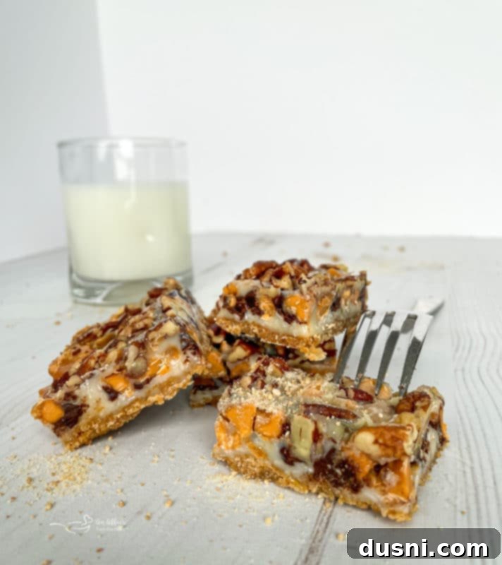 Seven Layer Magic Bars 16 front view of stack of seven layer cookies