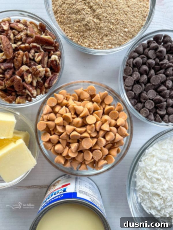 Seven Layer Magic Bars 5 peanut butter chips, chocolate chips, pecans, butter, coconut, sweetened condensed milk, graham crackers