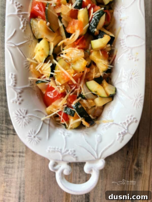 Bonefish Grill Copycat Zucchini and Tomatoes 6 Close-up of skillet with sauteed zucchini, tomatoes, and onion.