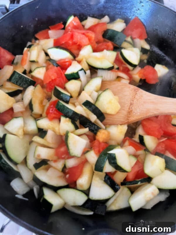 Bonefish Grill Copycat Zucchini and Tomatoes 8 Zucchini, onion, and tomatoes sautéing in a hot skillet.