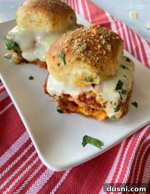 Hearty Italian Meatloaf Sliders 3 Close-up of baked Italian Meatloaf Sliders with melted cheese