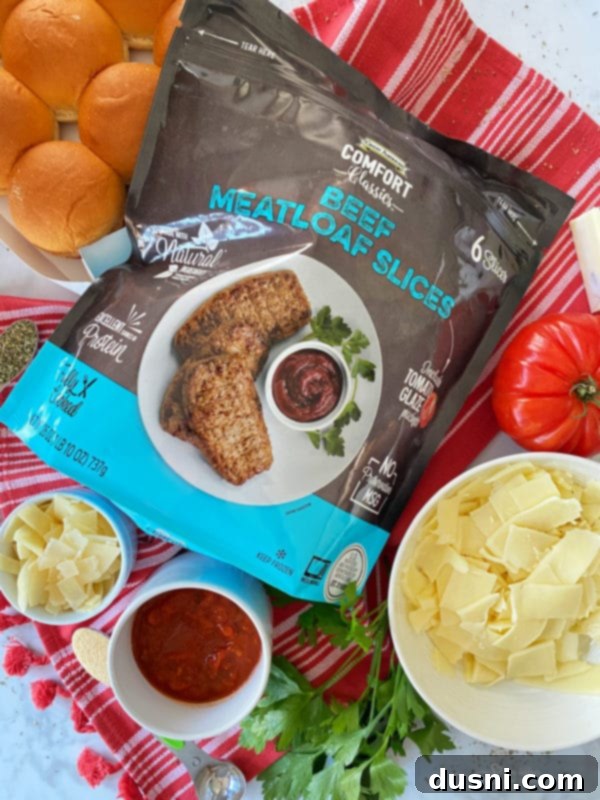 Hearty Italian Meatloaf Sliders 5 Stacked Italian Meatloaf Sliders with marinara sauce and cheese