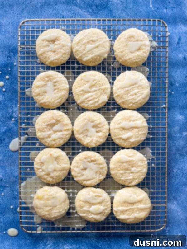Sunshine Lemon Chewies 11 Glazed lemon cookies arranged on a wire rack for the glaze to set.