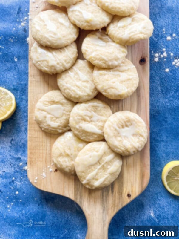 Sunshine Lemon Chewies 15 Pinterest graphic: Stack of glazed lemon cookies with text 'Chewy Glazed Lemon Cookies'.
