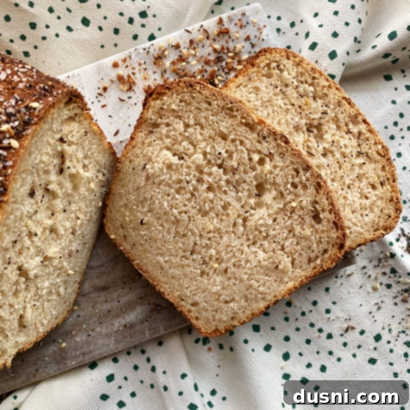A whole loaf of Everything Sauerkraut Bread, showing its texture and seasoning.