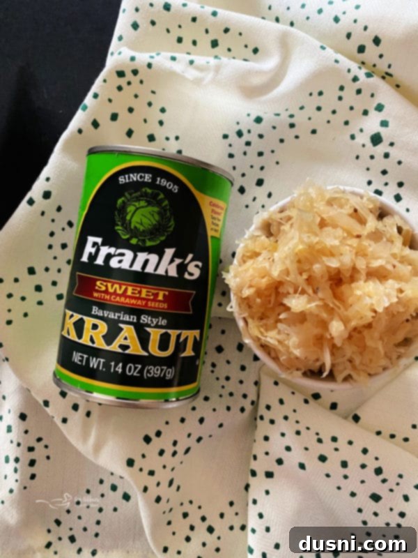 Freshly baked loaf of Everything Sauerkraut Bread cooling on a rack, with a golden crust.