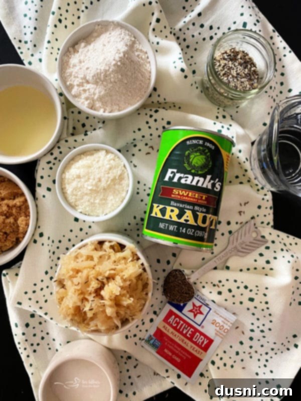 A close-up shot of a thick slice of Everything Sauerkraut Bread, revealing its texture.